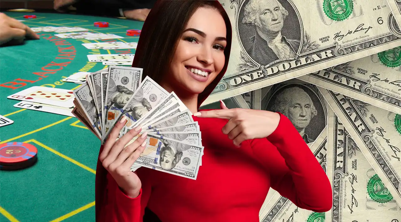 Smiling woman holding a fan of hundred-dollar bills at a blackjack table.